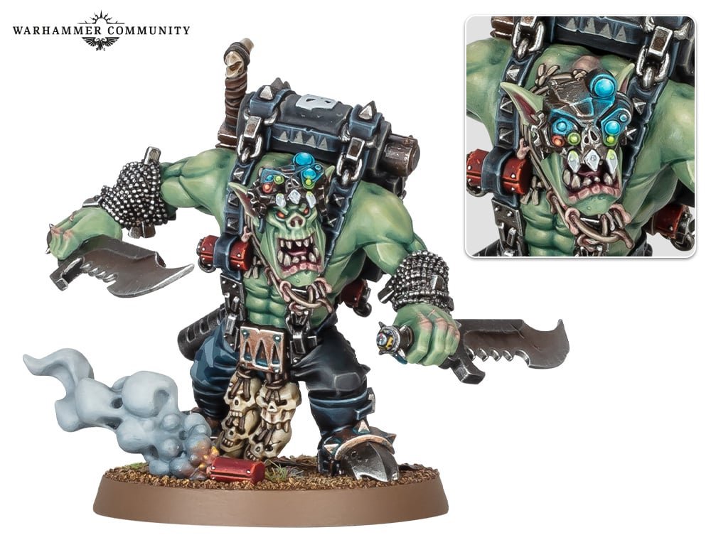 Boss Snikrot of the Red Skull Kommandos, twin blades drawn, a bionic targeting eye on his face