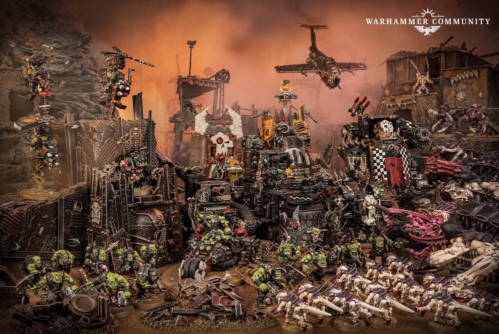 A huge Ork warband massed for battle under a burning orange sky