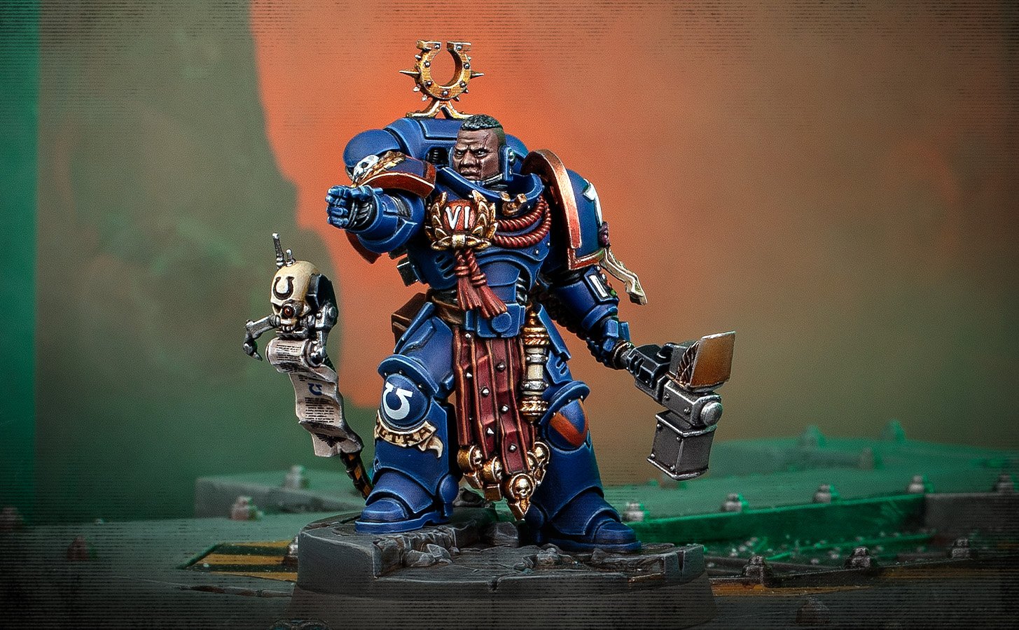 An Ultramarines Captain in Terminator armour carrying a thunder hammer and storm shield