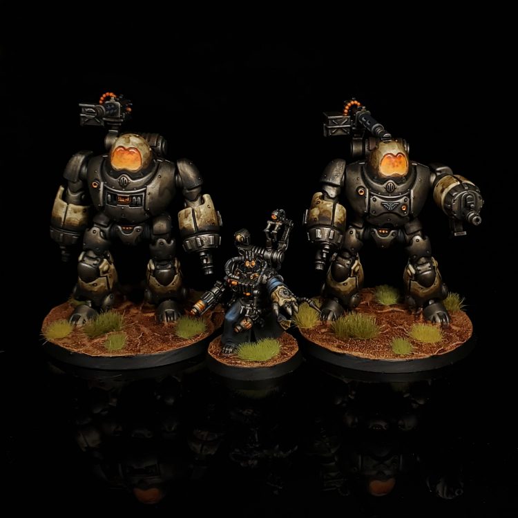 Two weathered Kastelan Robots with glowing orange faceplates flank their Cybernetica Datasmith