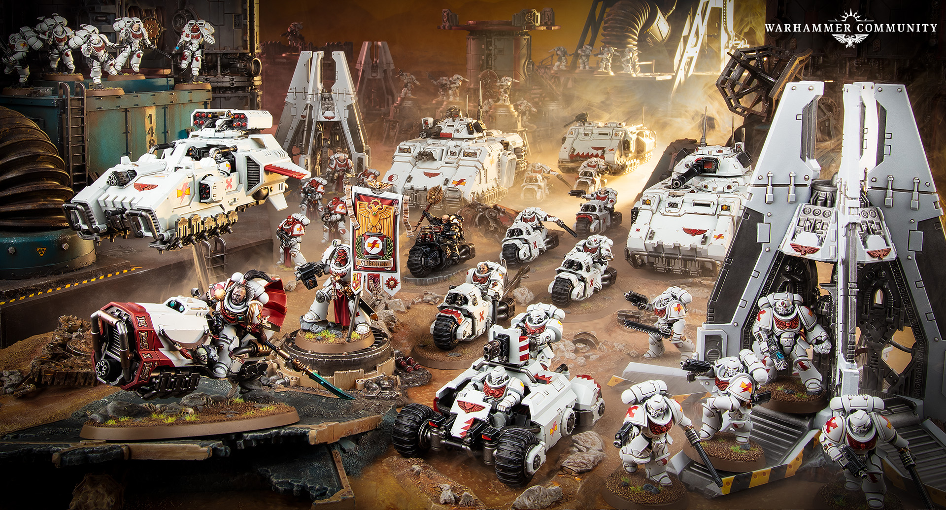 A White Scars army of bikes, speeders and tanks advancing across a dusty industrial battlefield