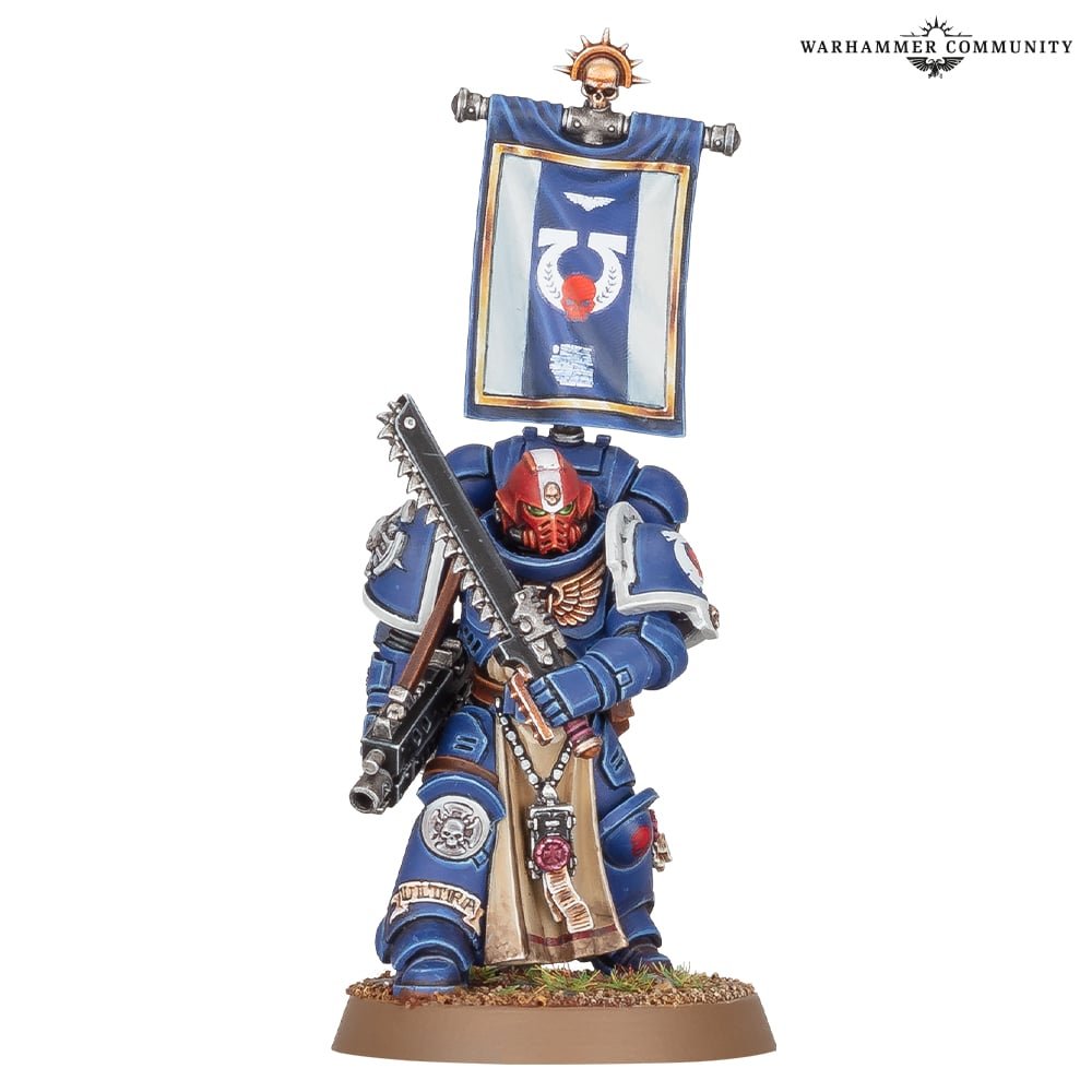 A Primaris Sternguard Veteran Sergeant in Ultramarines blue with a back banner and chainsword
