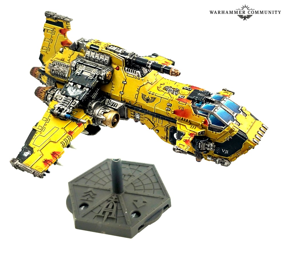 A painted Imperial Fists Thunderhawk Gunship on its flight stand